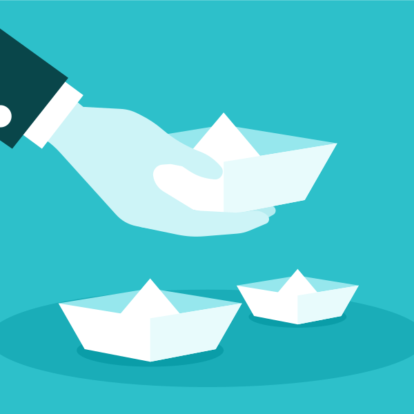Hand Holding Paper Boat