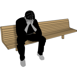 Sad Man Sitting on a Park Bench